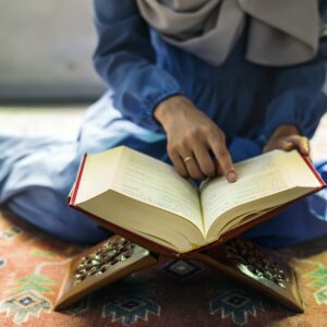 Muslim woman reading from the quran